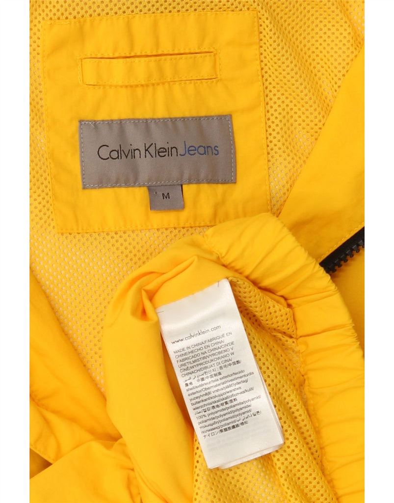 CALVIN KLEIN Mens Hooded Rain Jacket UK 38 Medium Yellow Polyamide Vintage Calvin Klein and Second-Hand Calvin Klein from Messina Hembry 