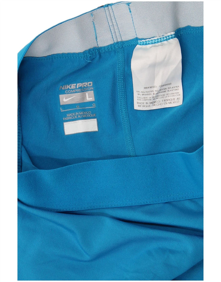 Γυναικείο κολάν NIKE Dri Fit Capri UK 14 Large Blue Polyester