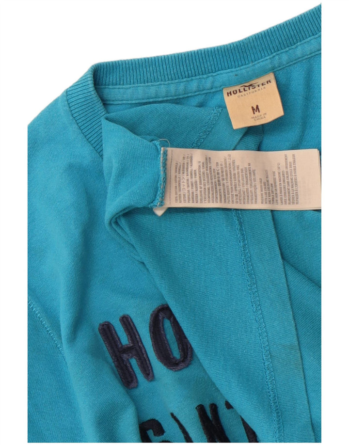 Ανδρικό γραφικό μπλουζάκι Hollister Top από μεσαίο μπλε βαμβακερό