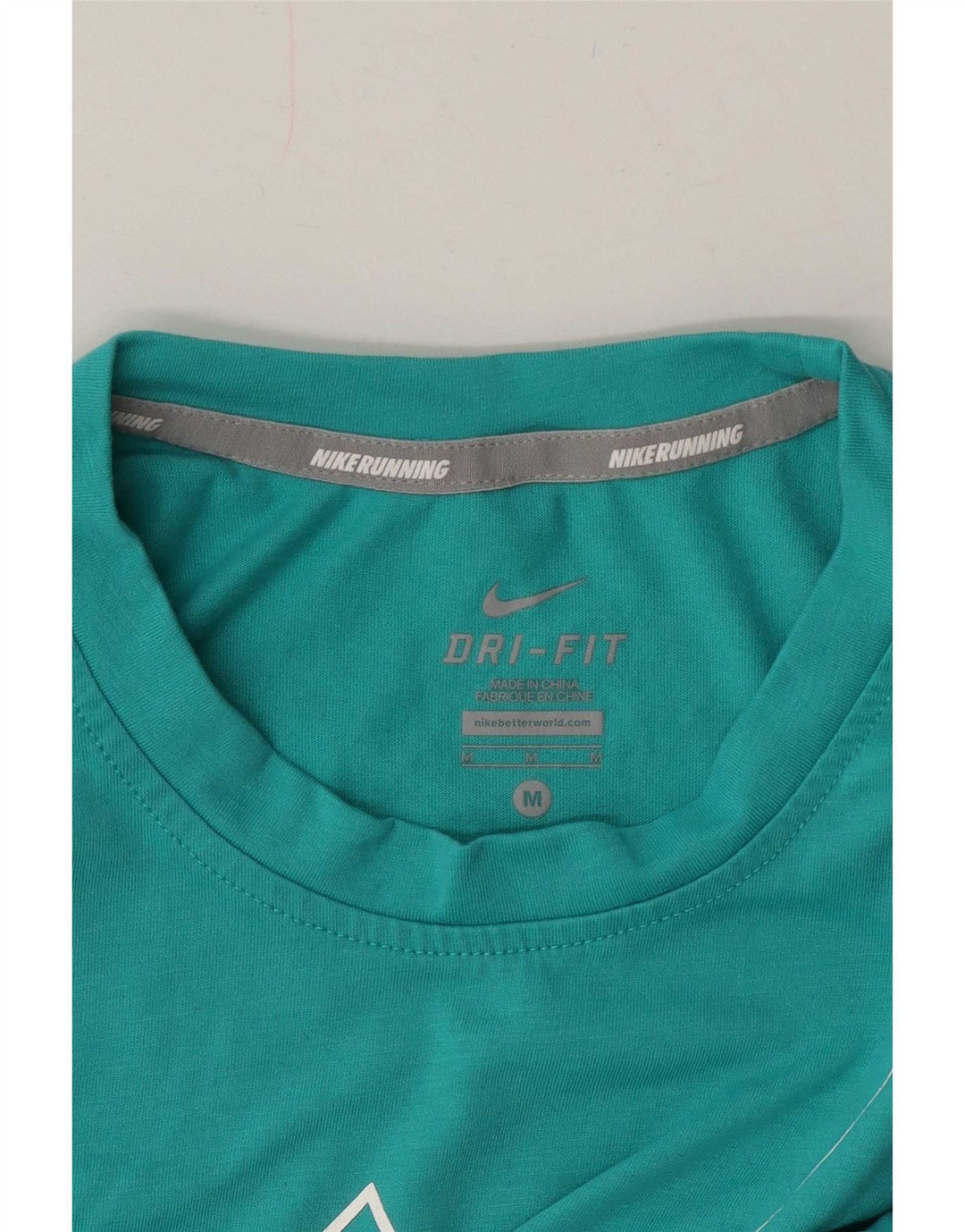 Γυναικείο γραφικό γιλέκο Nike Dri Fit Top 14 μεσαίου τυρκουάζ χρώματος