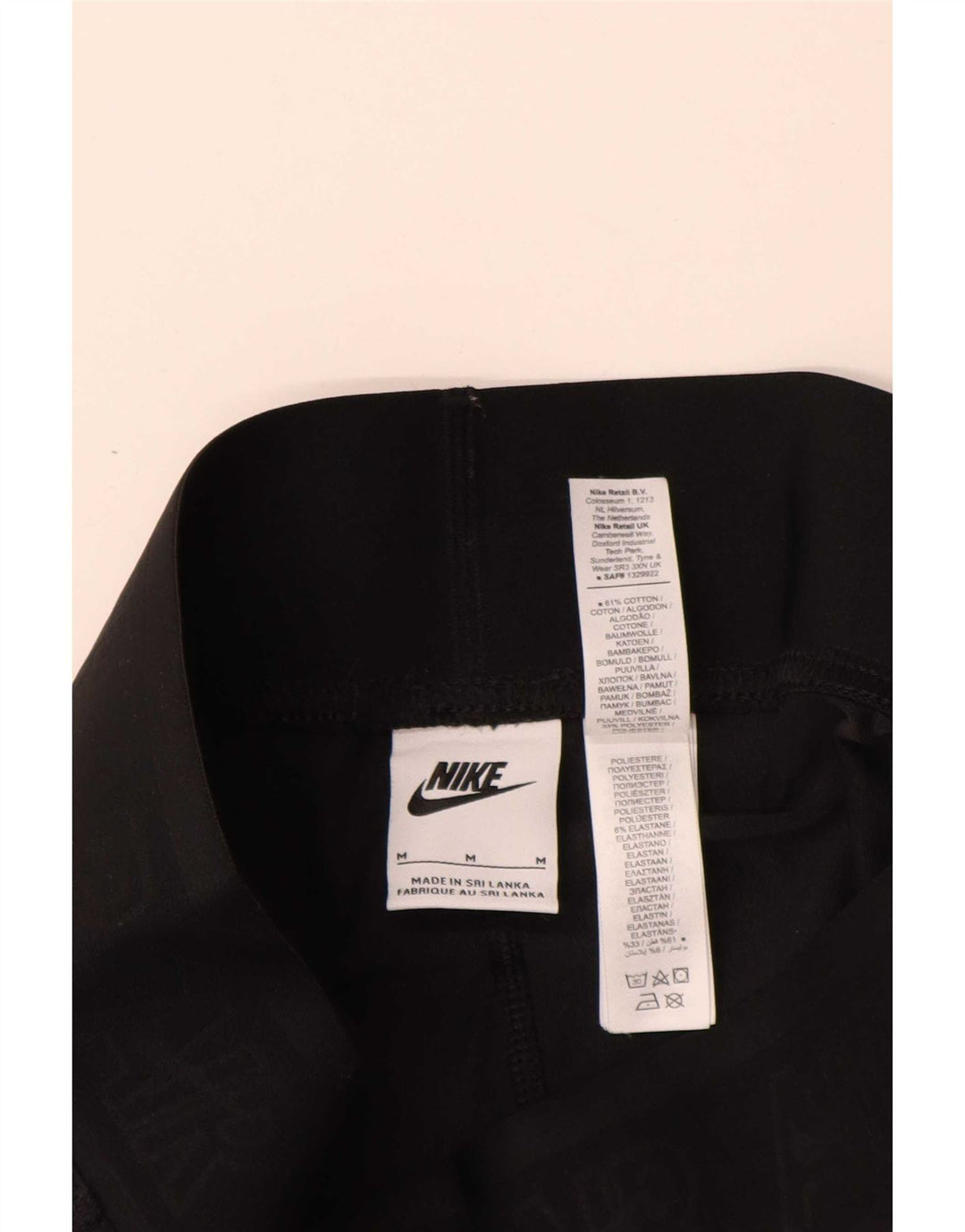 Γυναικεία γραφικά κολάν Nike UK 12 μεσαίο μαύρο βαμβακερό