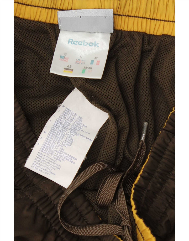 Ανδρική φόρμα γραφικής Reebok Παντελόνι Joggers Μικρός καφέ πολυεστέρας