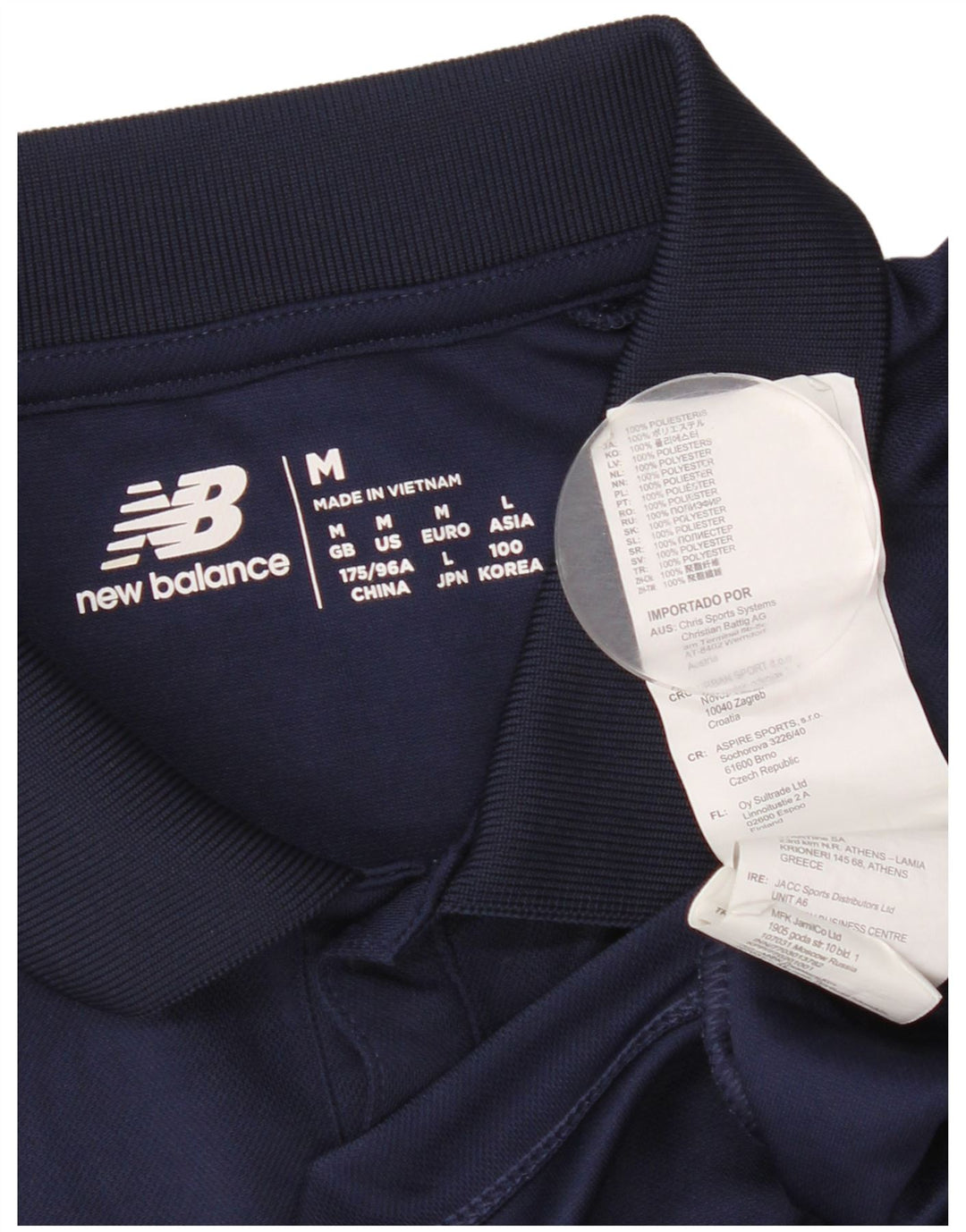 New Balance Ανδρικό γραφικό πουκάμισο πόλο μεσαίου μπλε πολυεστέρα