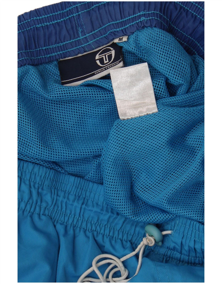 Ανδρικό αθλητικό σορτς Sergio Tacchini με μεσαίο μπλε χρώμα