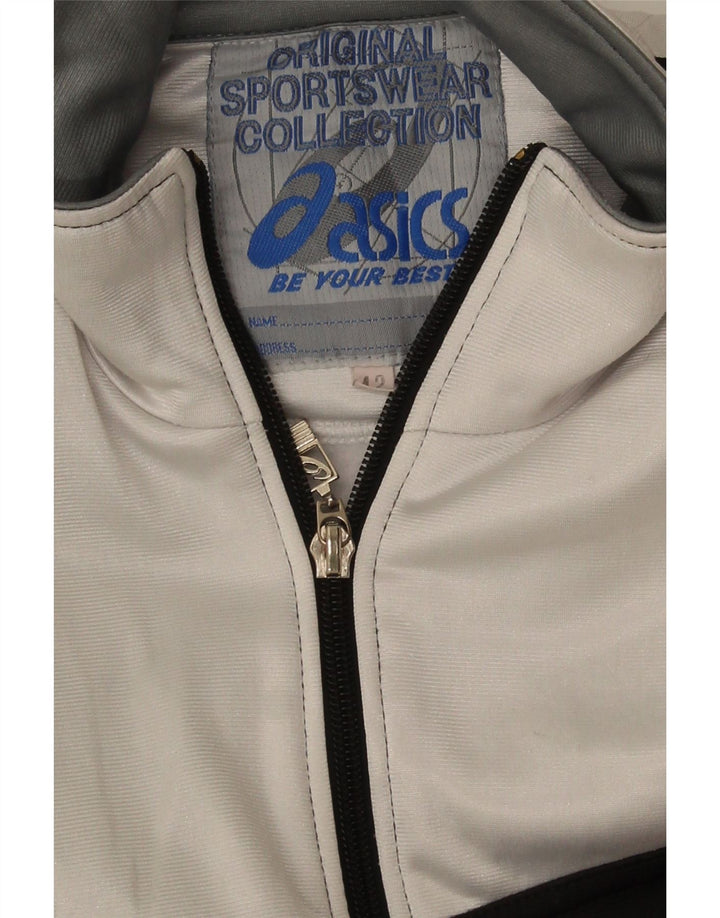 Γυναικεία αθλητική φόρμα γραφικών Asics Top Jacket IT 42 Medium Black Colourblock
