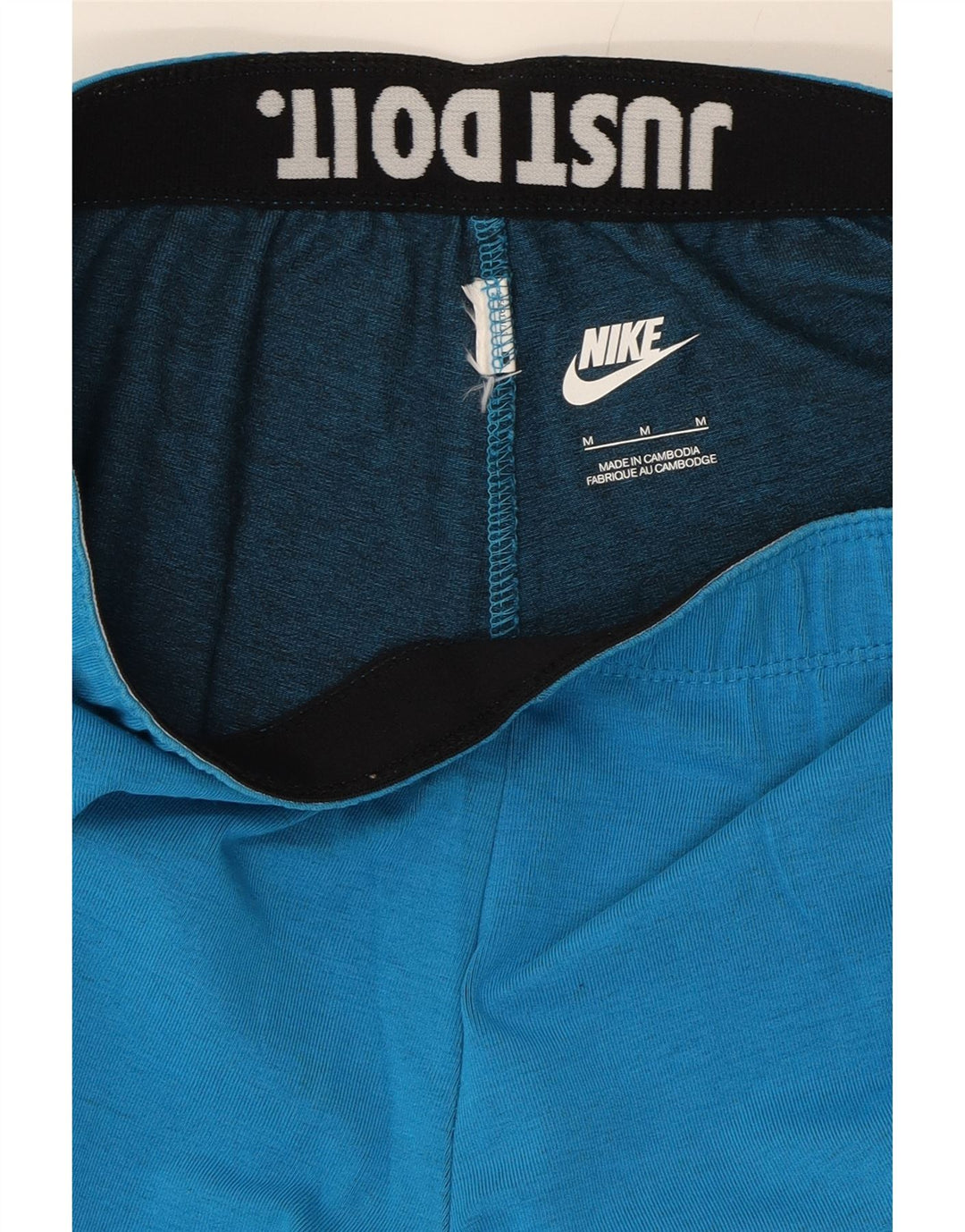 NIKE Womens Graphic Leggings UKL 12 Medium Blue Vintage Nike and Second-Hand Nike from Messina Hembry 