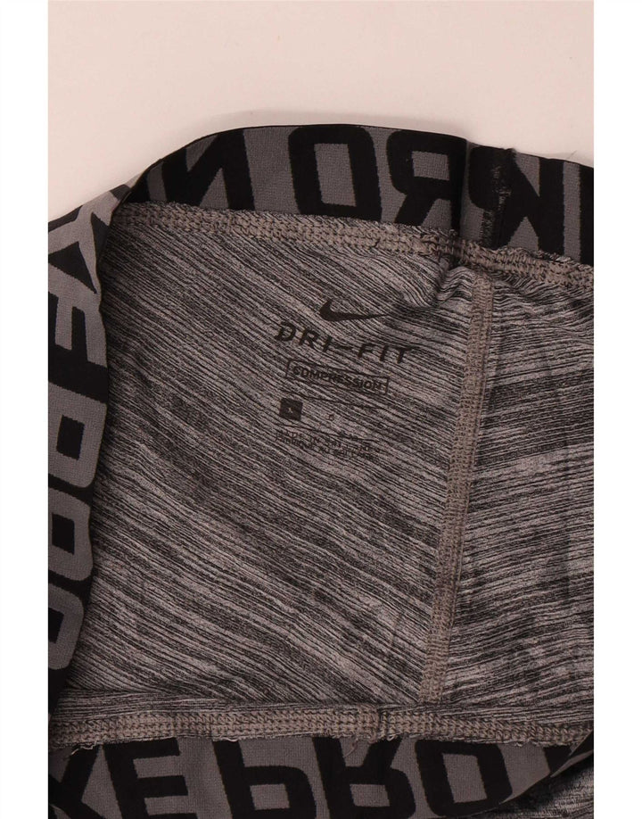 Ανδρικά γραφικά κολάν Nike Dri Fit με μεγάλα γκρι φλύκταινα