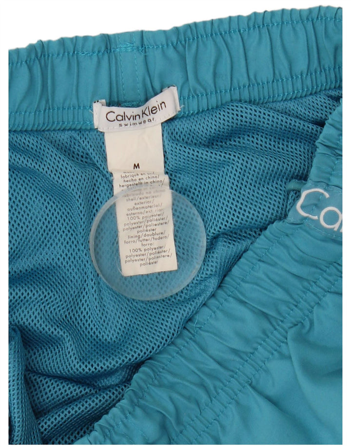 Γραφικό ανδρικό σορτς κολύμβησης Calvin Klein με μεσαίο μπλε πολυεστέρα