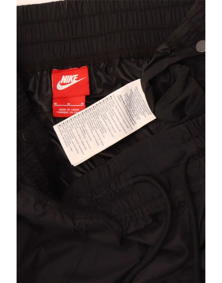 Γυναικείο αδιάβροχο παντελόνι Nike Joggers UK 12 μεσαίο μαύρο πολυεστέρα