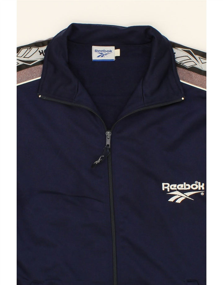 REEBOK Boys Tracksuit Top Jacket 15-16 Years Navy Blue Colourblock Vintage Reebok and Second-Hand Reebok from Messina Hembry 