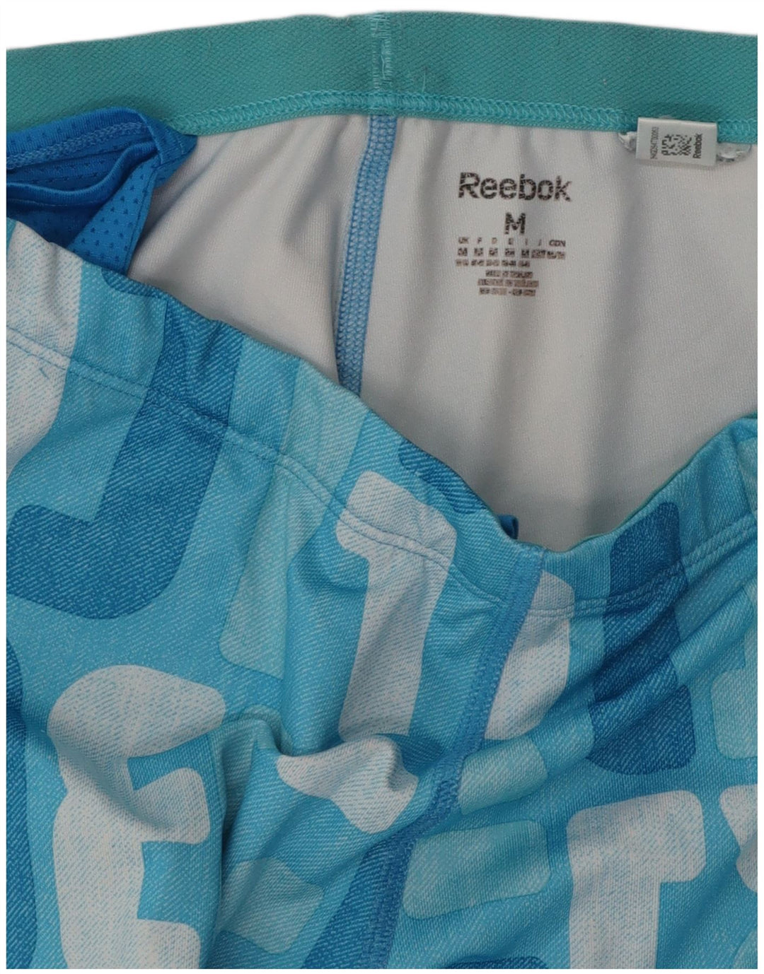 Γυναικεία φόρμα REEBOK γραφικά παντελόνια UK 12 Medium Blue Colourblock