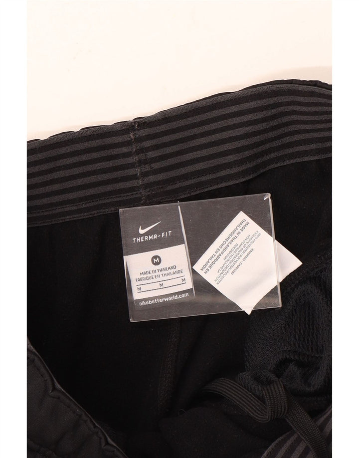 Ανδρικές φόρμες Nike Therma-Fit Παντελόνια μεσαίου μαύρου πολυεστέρα