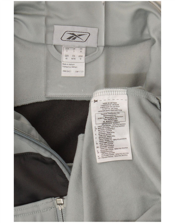 Ανδρική αθλητική φόρμα Reebok Top Jacket Μικρό Γκρι Χρώμα Πολυεστέρας