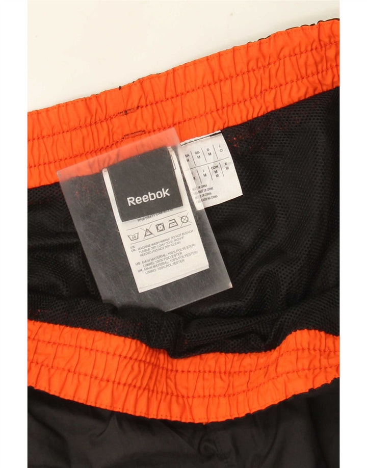 Ανδρική φόρμα Reebok Παντελόνι Joggers Μεσαίο Μαύρο Πολυεστέρα
