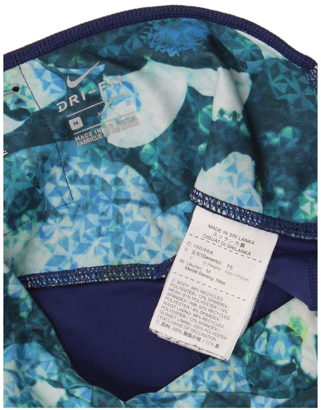 Γυναικεία κολάν Nike Dri Fit Capri UK 12 μεσαία πολύχρωμα φλοράλ